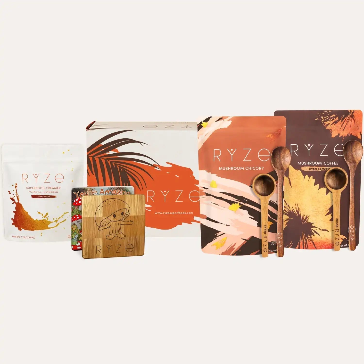 Collection of RYZE products including packaging and wooden spoons on a white background