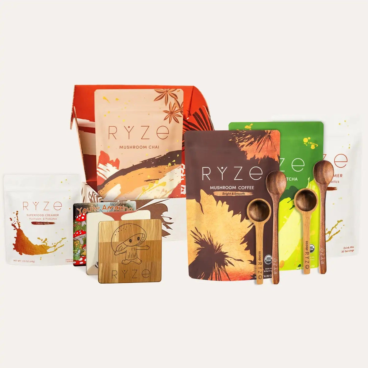 Collection of RYZE products including boxes, bags, and wooden spoons on a white background